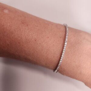 NWOT silver tone bangle with cubic zirconia